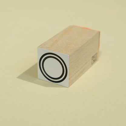 Tampon à cadre circulaire