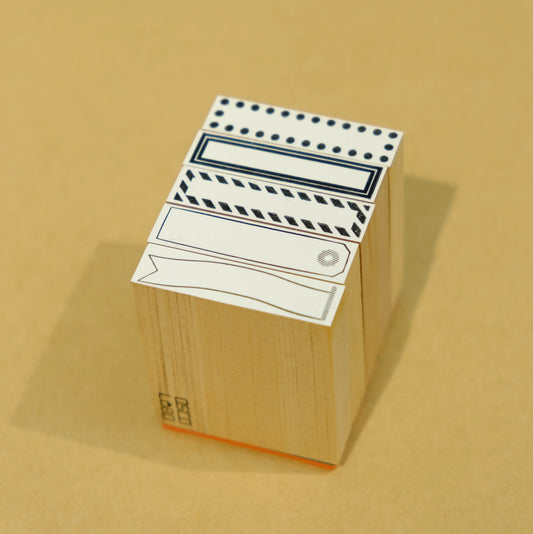 Tampon à ruban adhésif pour cadre 