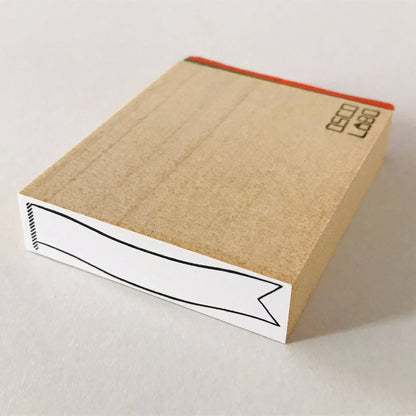 Tampon à ruban adhésif pour cadre 